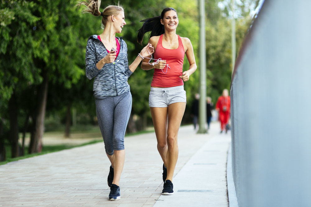 Fit women jogging outdoors and living a healthy lifestyle