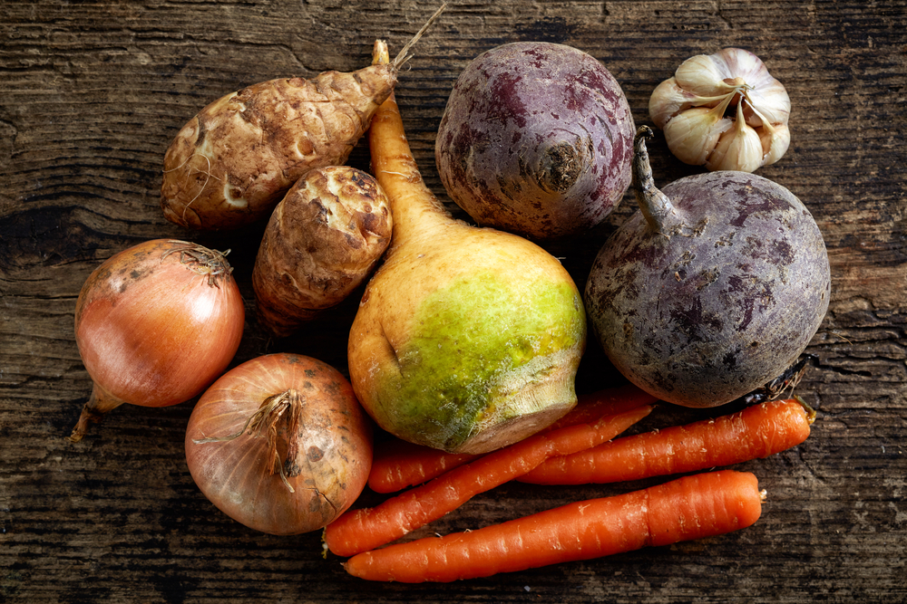 various fresh raw vegetables on wooden table, top view