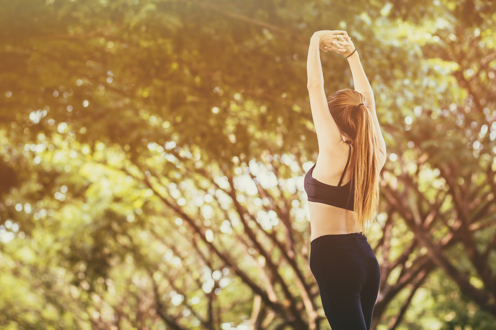 sport girl warm up her body for prepare run