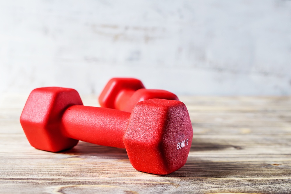 Pair of orange 3 kg dumbbells