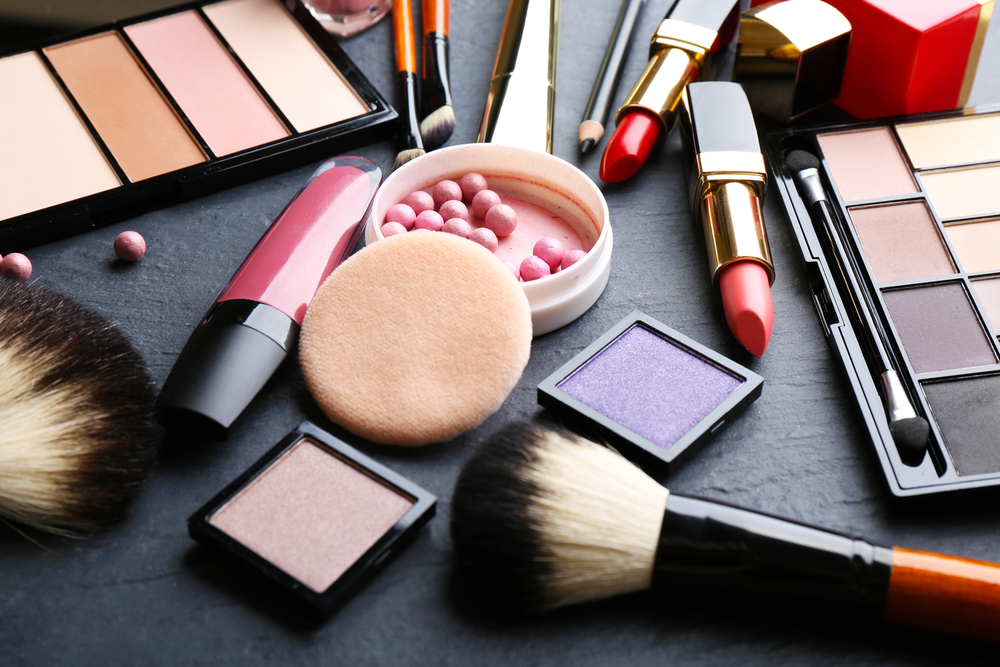 Cosmetics on dark background, closeup