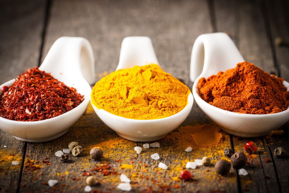 Spices. Spice in Wooden spoon. Herbs. Curry, Saffron, turmeric, cinnamon and other on a wooden rustic background. Pepper. Large collection of different spices and herbs. Salt, paprika.