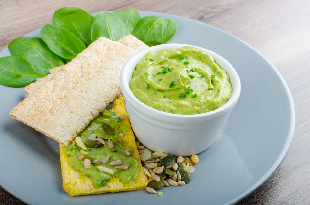 Avocado-Buttermilk Green Goddess Dip with fresh herbs and  Crispbread with a mixture of seeds